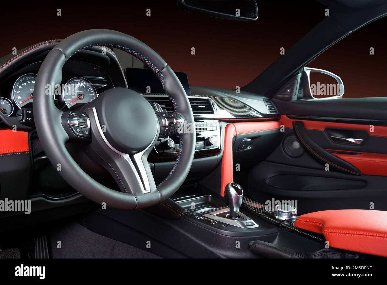 Modern luxury car Interior steering wheel, shift lever and dashboard