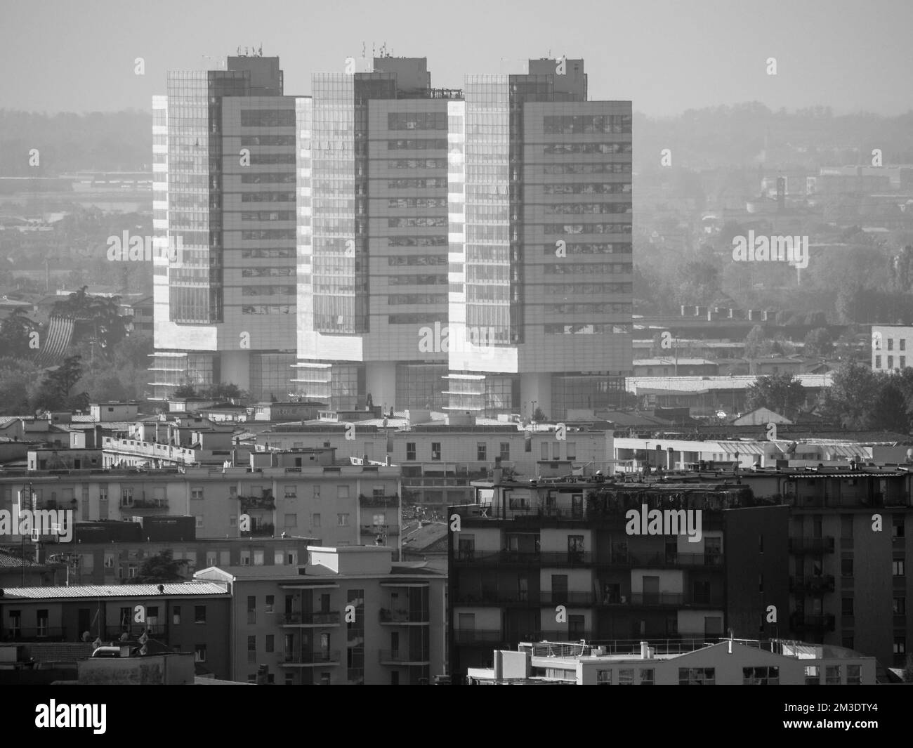 Brescia, Italy - November 2022 Hill top view of Brixia city scenic pano and main roofs Stock Photo