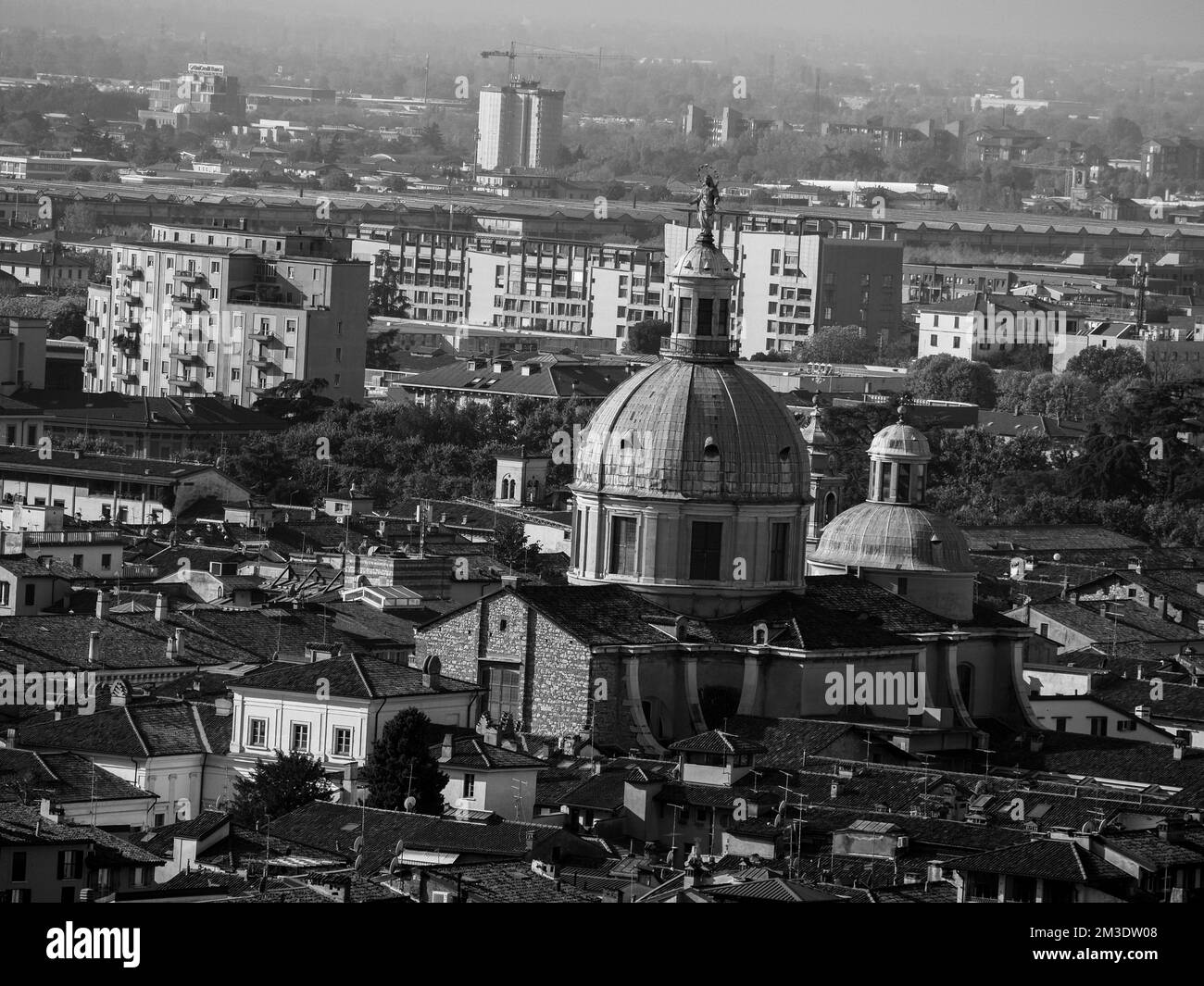 Brescia, Italy - November 2022 Hill top view of Brixia city scenic pano and main roofs Stock Photo