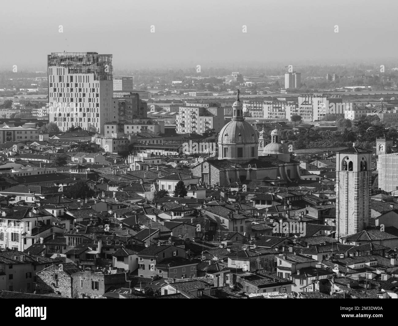 Brescia, Italy - November 2022 Hill top view of Brixia city scenic pano and main roofs Stock Photo