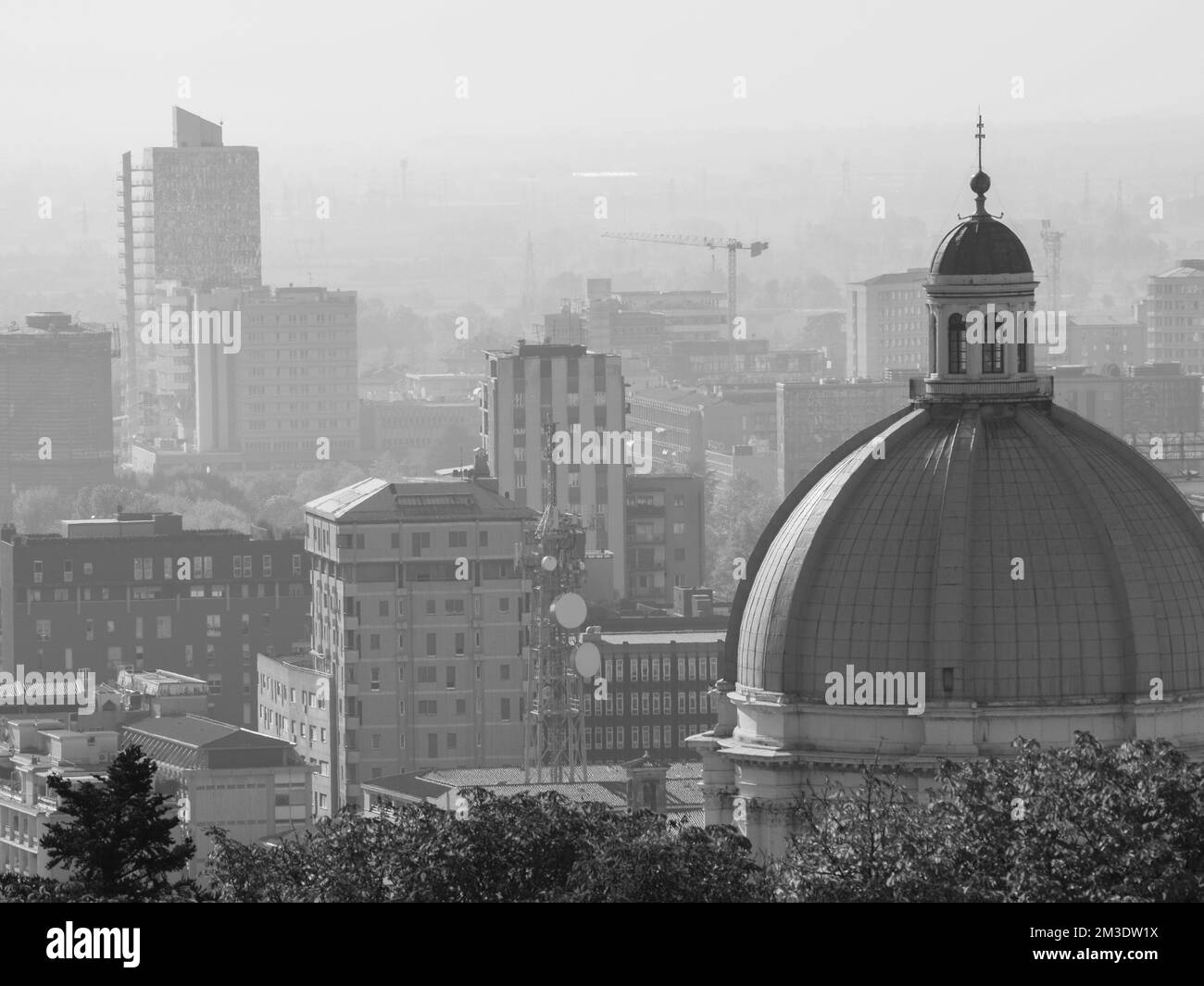 Brescia, Italy - November 2022 Hill top view of Brixia city scenic pano and main roofs Stock Photo