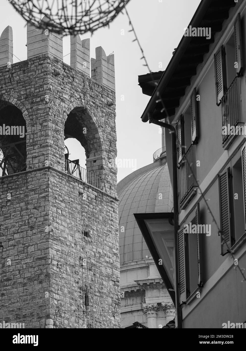 Brescia, Italy - November 2022 Hill top view of Brixia city scenic pano and main roofs Stock Photo