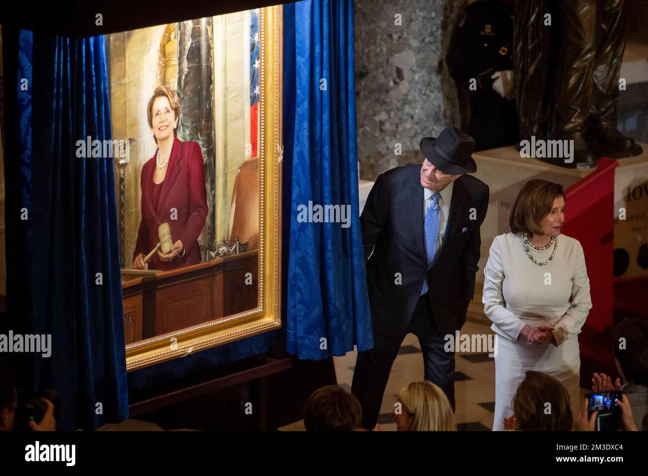 Washington, Vereinigte Staaten. 14th Dec, 2022. Speaker of the United States House of Representatives Nancy Pelosi (Democrat of California) is joined by her husband Paul Pelosi during a ceremony to unveil her official portrait in Statuary Hall at the US Capitol in Washington, DC, Wednesday, December 14, 2022. Credit: Rod Lamkey/CNP/dpa/Alamy Live News Stock Photo