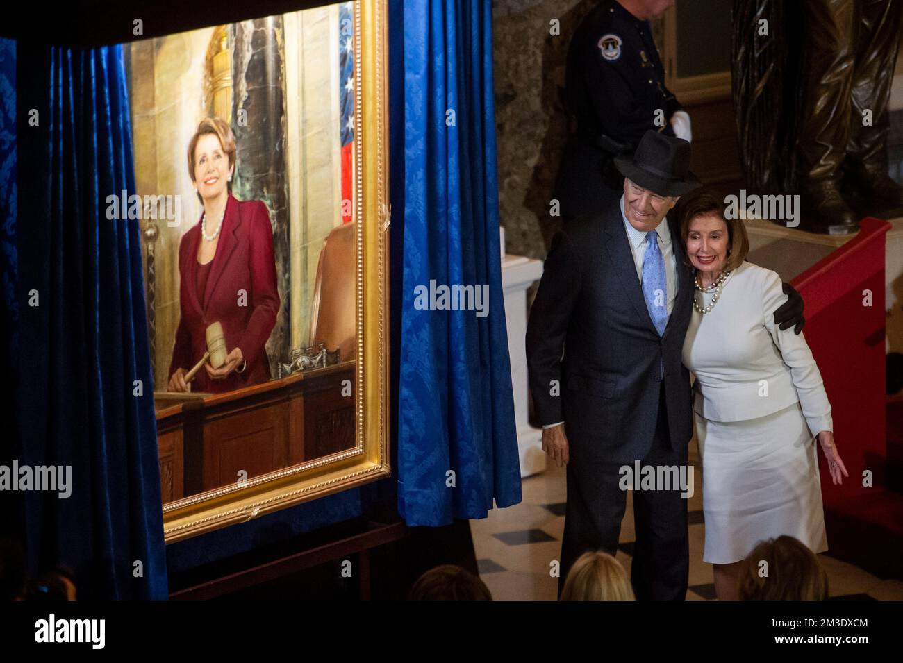 Washington, Vereinigte Staaten. 14th Dec, 2022. Speaker of the United States House of Representatives Nancy Pelosi (Democrat of California) is embraced by her husband Paul Pelosi during a ceremony to unveil her official portrait in Statuary Hall at the US Capitol in Washington, DC, Wednesday, December 14, 2022. Credit: Rod Lamkey/CNP/dpa/Alamy Live News Stock Photo