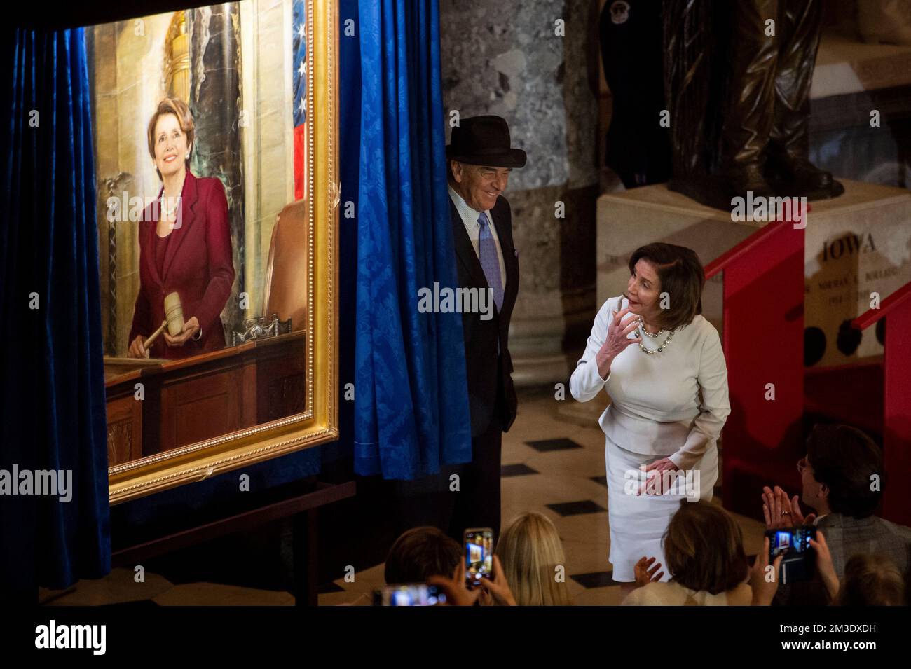 Washington, Vereinigte Staaten. 14th Dec, 2022. Speaker of the United States House of Representatives Nancy Pelosi (Democrat of California) is joined by her husband Paul Pelosi during a ceremony to unveil her official portrait in Statuary Hall at the US Capitol in Washington, DC, Wednesday, December 14, 2022. Credit: Rod Lamkey/CNP/dpa/Alamy Live News Stock Photo