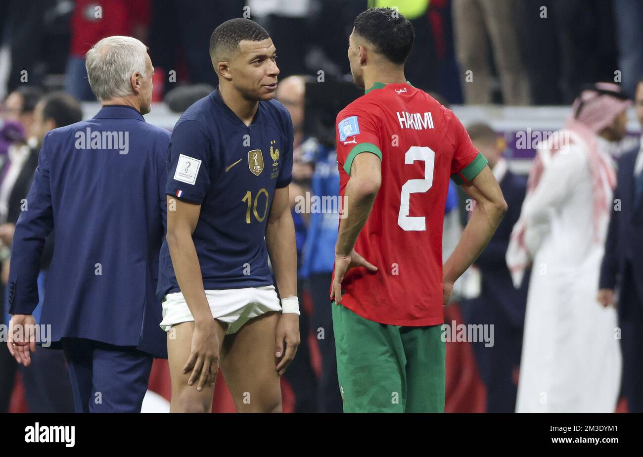 Kylian Mbappe of France exchanges his jersey with Achraf Hakimi of Morocco  following the FIFA World Cup 2022, Semi-final football match between France  and Morocco on December 14, 2022 at Al Bayt