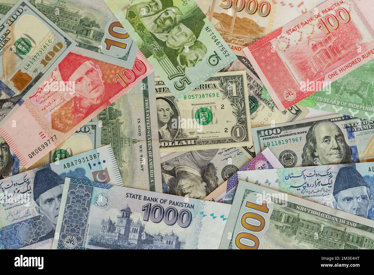 Pakistan bank notes with US dollar bills closeup Stock Photo