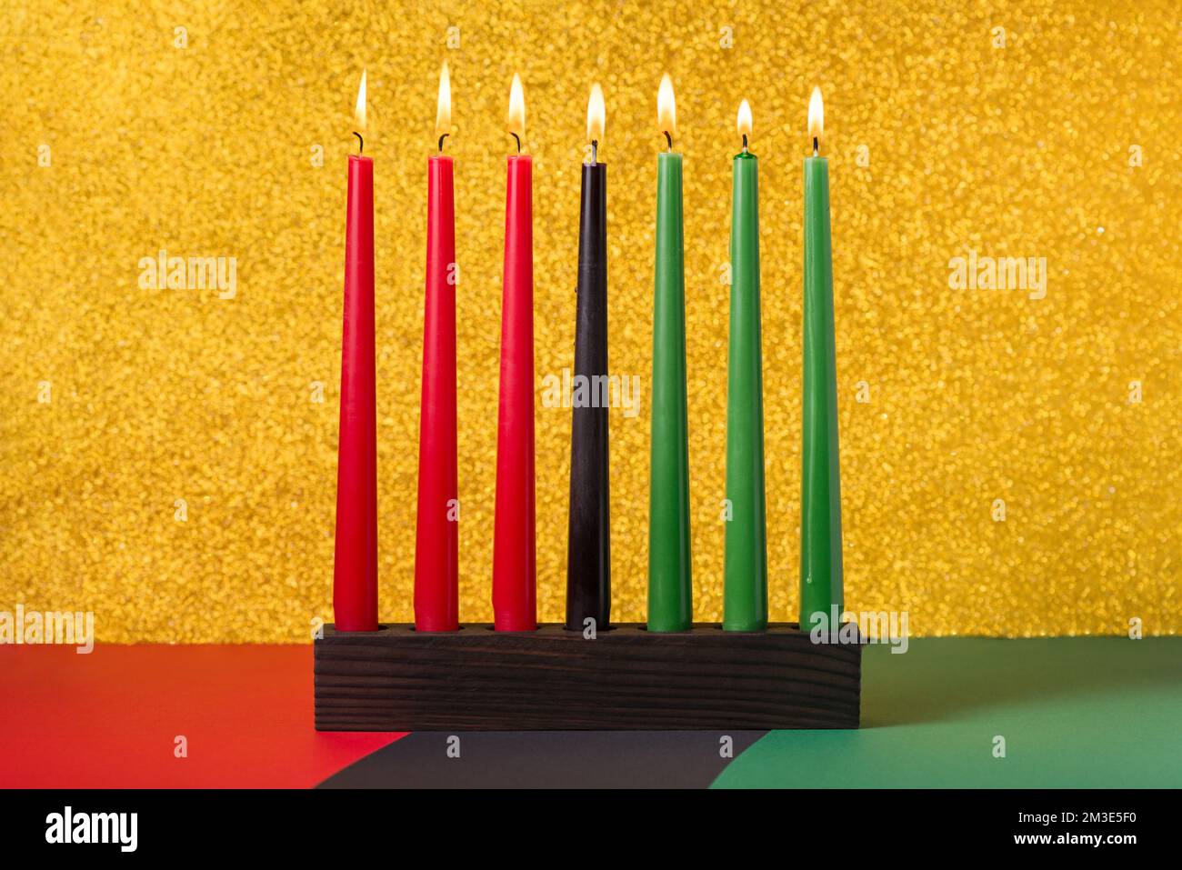 African American Kwanzaa holiday concept with traditional lit candles on symbolic background Stock Photo