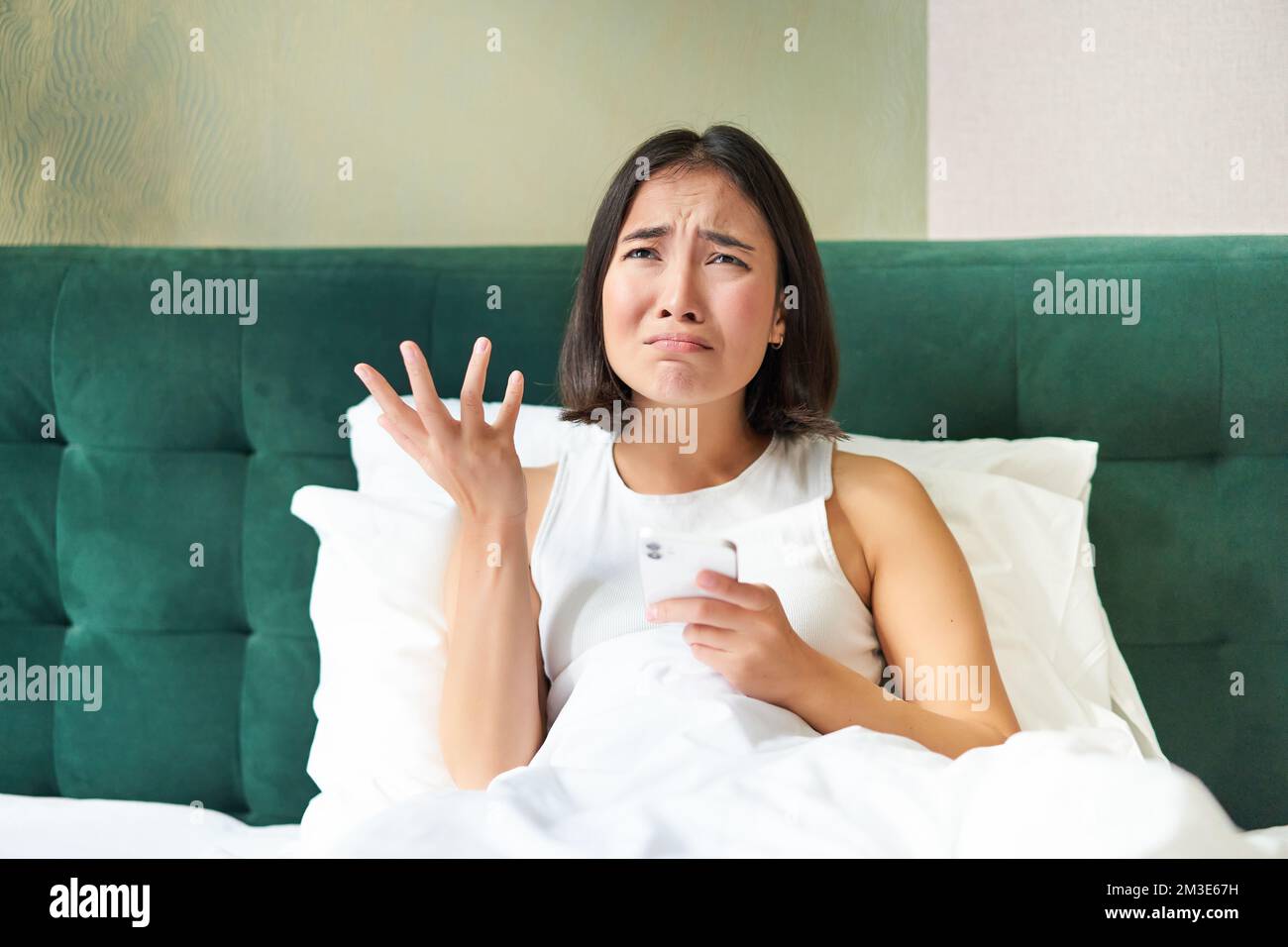 Asian woman crying in bed hi-res stock photography and images - Alamy
