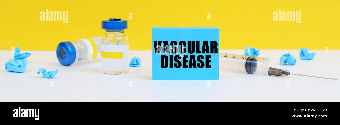 Medicine and health concept. On the table is a syringe, injections and a blue sign with the inscription - vascular disease Stock Photo