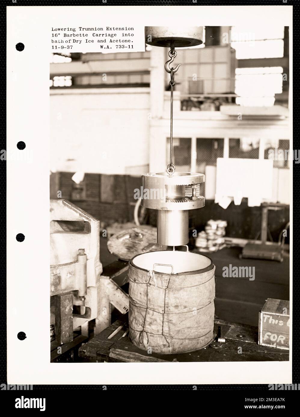 Lowering trunnion extension 16' barbette carriage into bath of dry ice and acetone , Armories