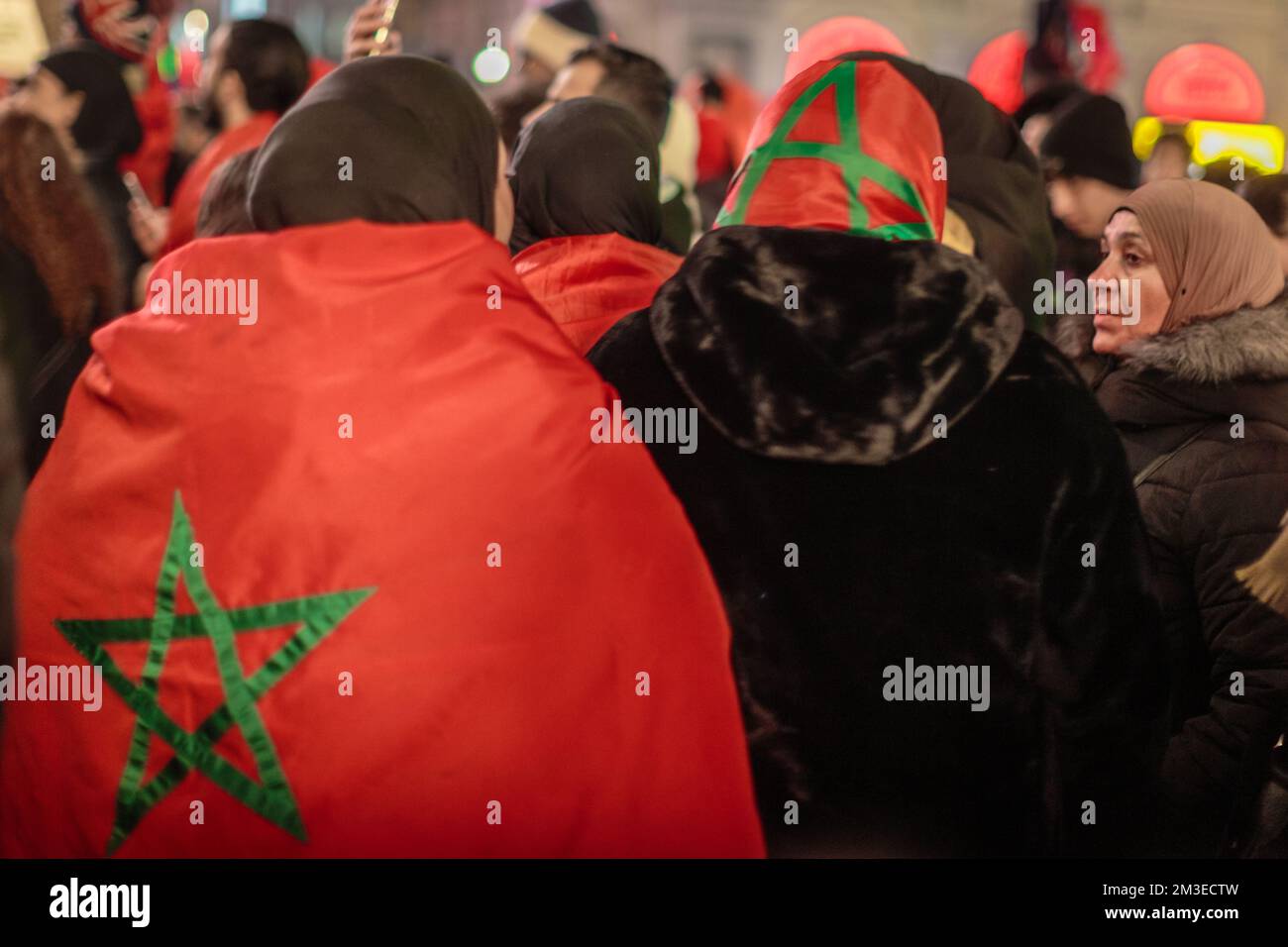 Morocco soccer fans along with arabs, and africans fans celebrates the continued success of the Moroccan football team at Qatar 2022. Stock Photo