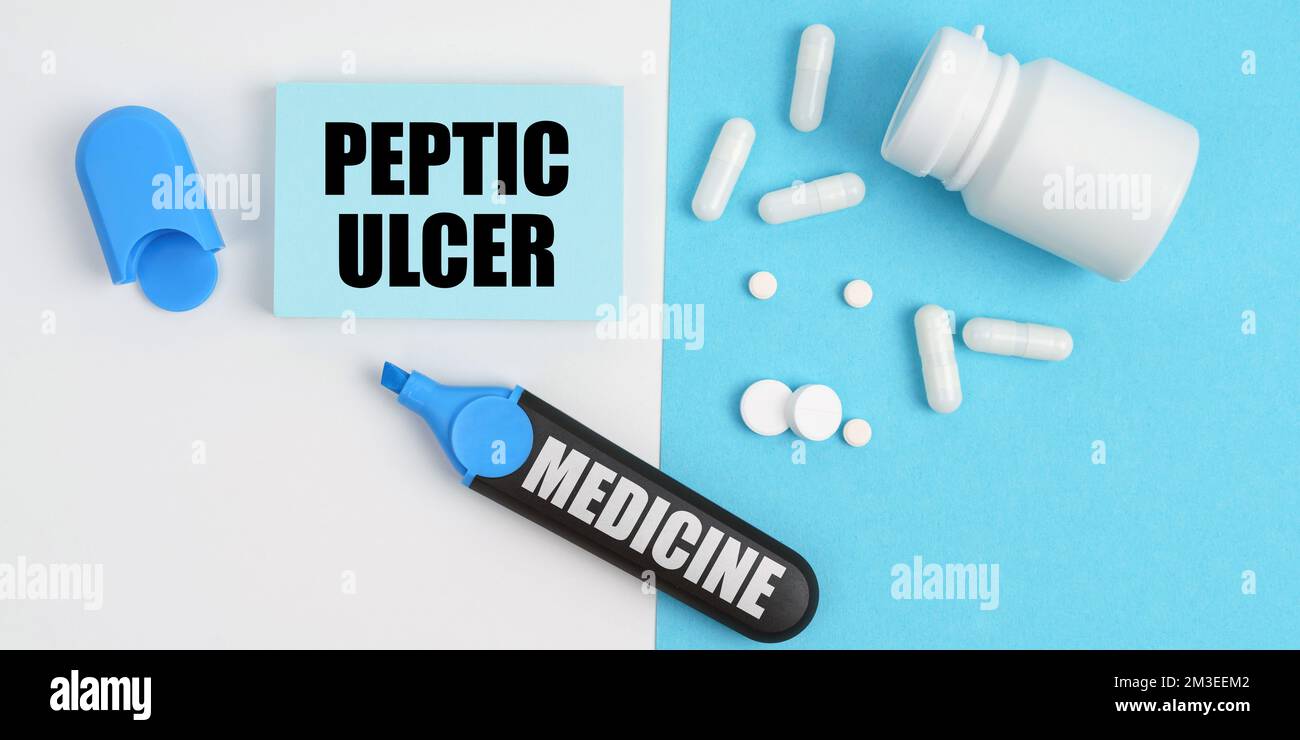 Medical concept. On the white and blue surface are pills, a marker and