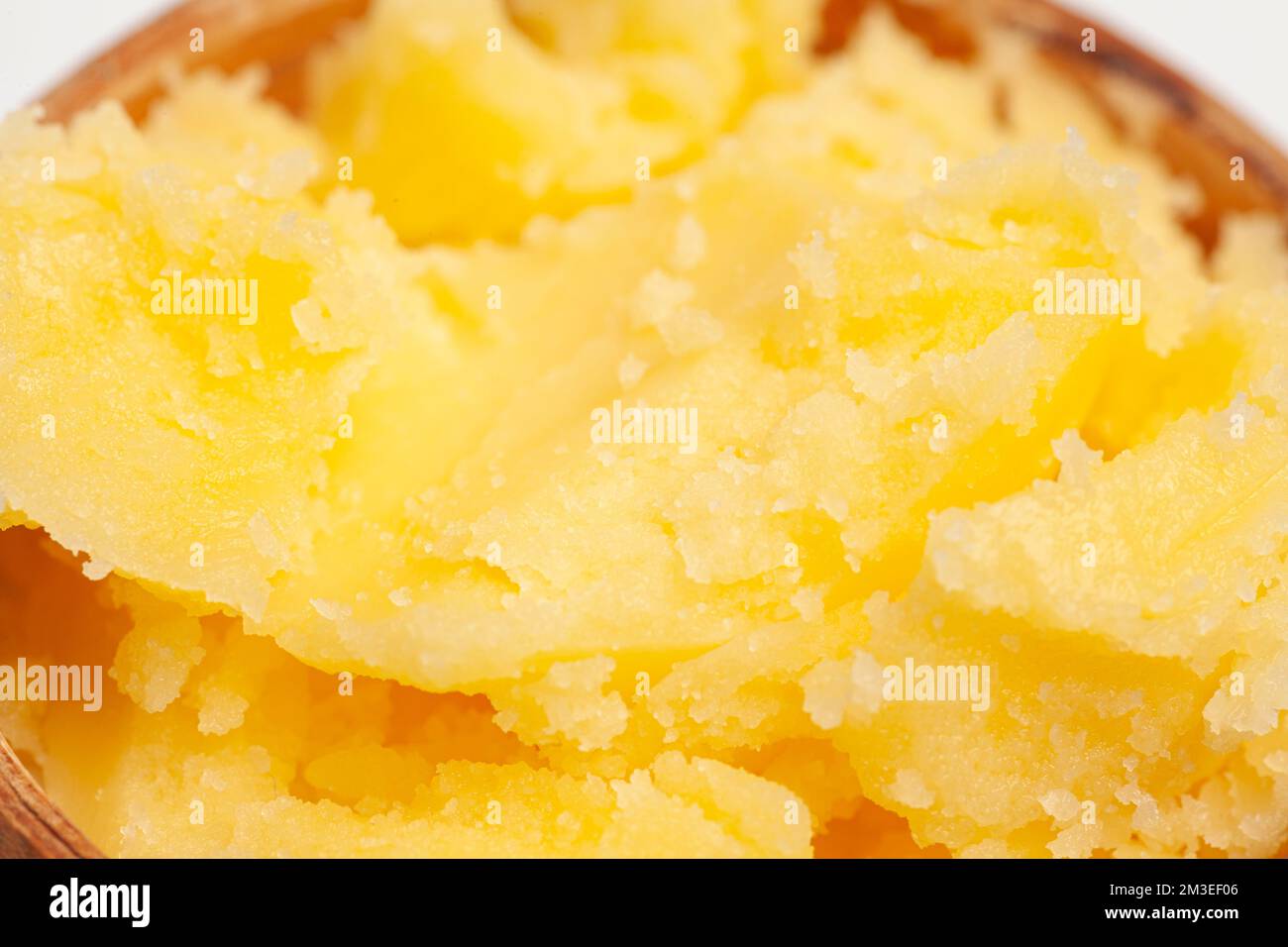 Homemade melted ghee clarified butter close up macro food background