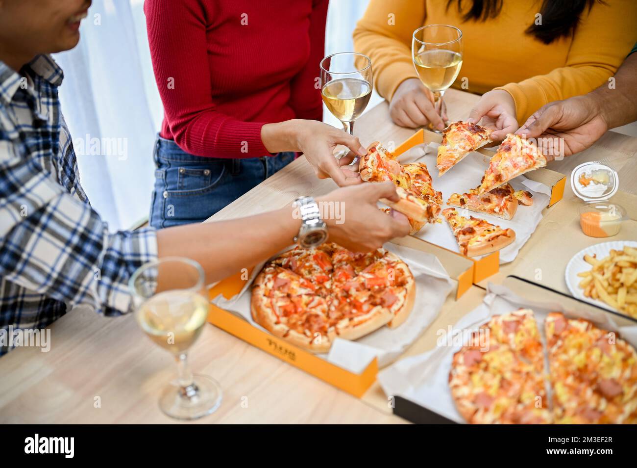 close-up image, A group of friends eating pizza in the party together. New  year party, Birthday party, Pizza party at home Stock Photo - Alamy