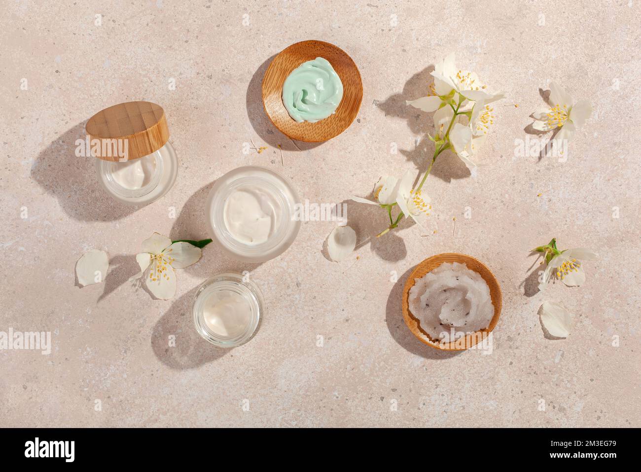 skincare products and jasmine flowers. natural cosmetics for home spa treatment Stock Photo