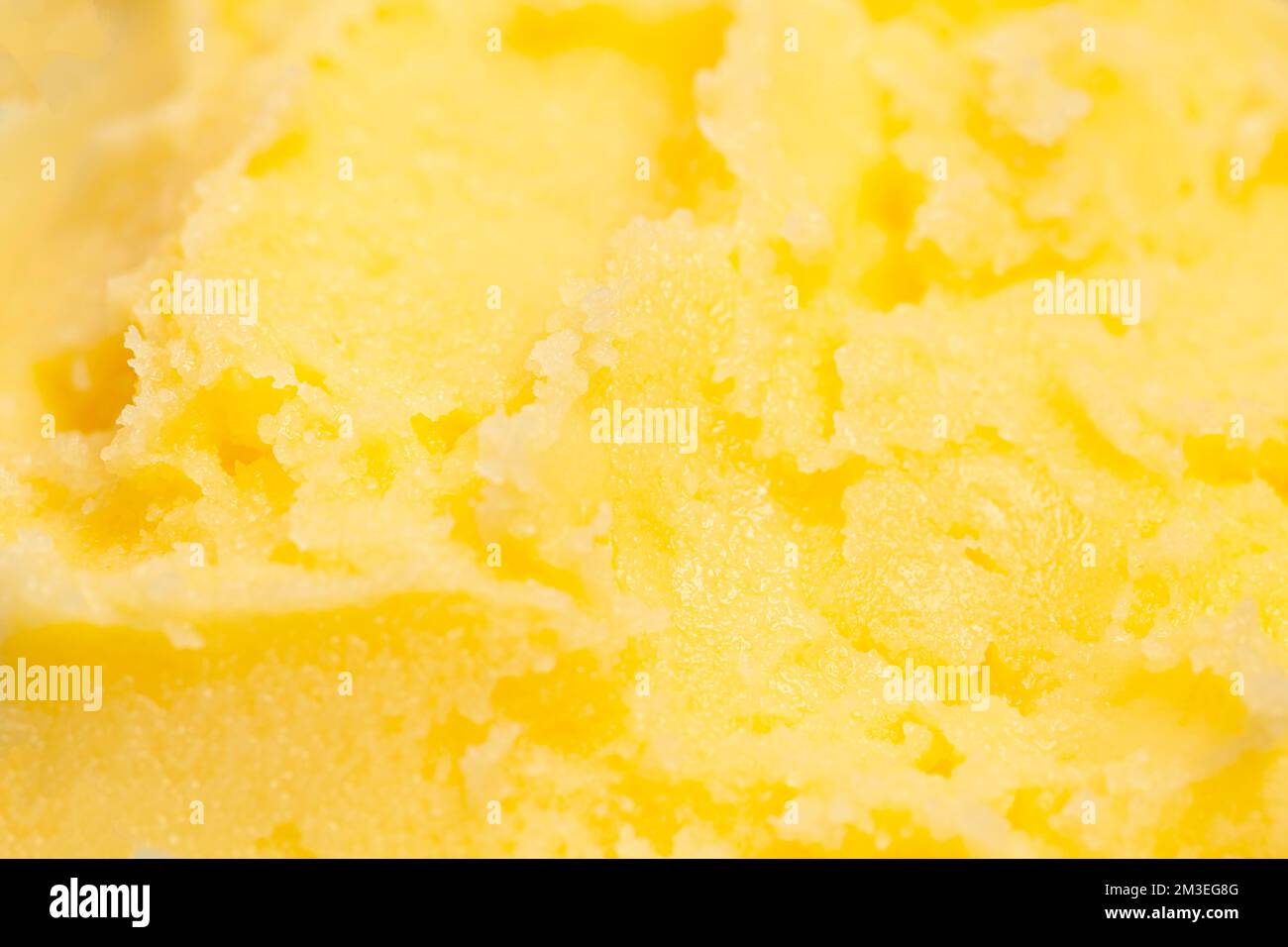 Homemade melted ghee clarified butter close up macro food background