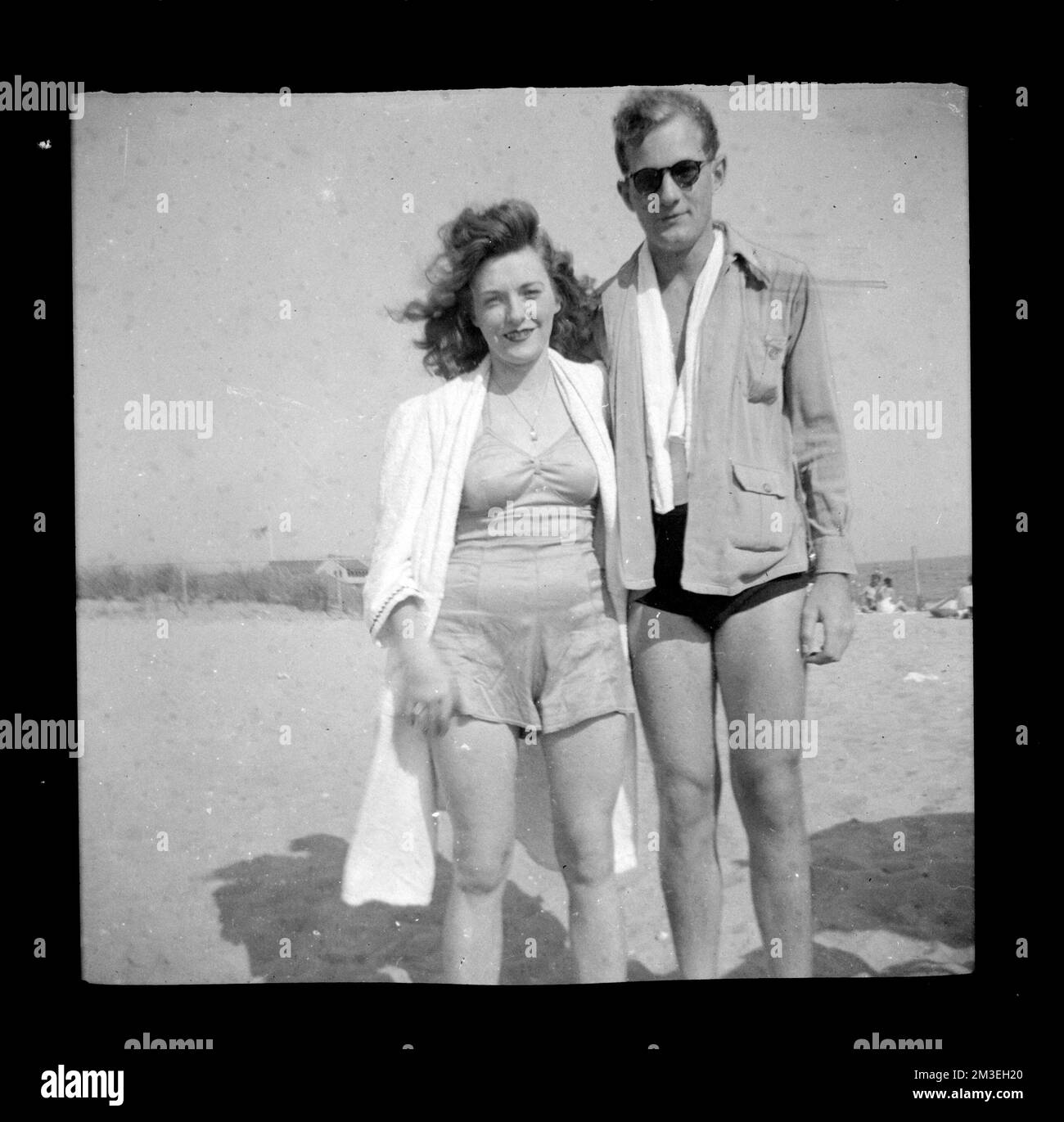 Man and woman in bathing suits on the beach , Bathing suits, Beaches