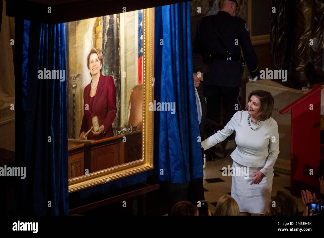 Speaker of the United States House of Representatives Nancy Pelosi (Democrat of California) is joined by her husband Paul Pelosi as she draws back the curtain to unveil her official portrait in Statuary Hall at the US Capitol in Washington, DC, USA, Wednesday, December 14, 2022. Photo by Rod Lamkey/CNP/ABACAPRESS.COM Stock Photo