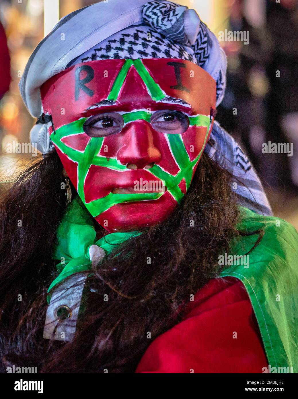A Morocco soccer fan in Piccadilly comes out to celebrate the continued success of the Moroccan football team at Qatar 2022. Stock Photo