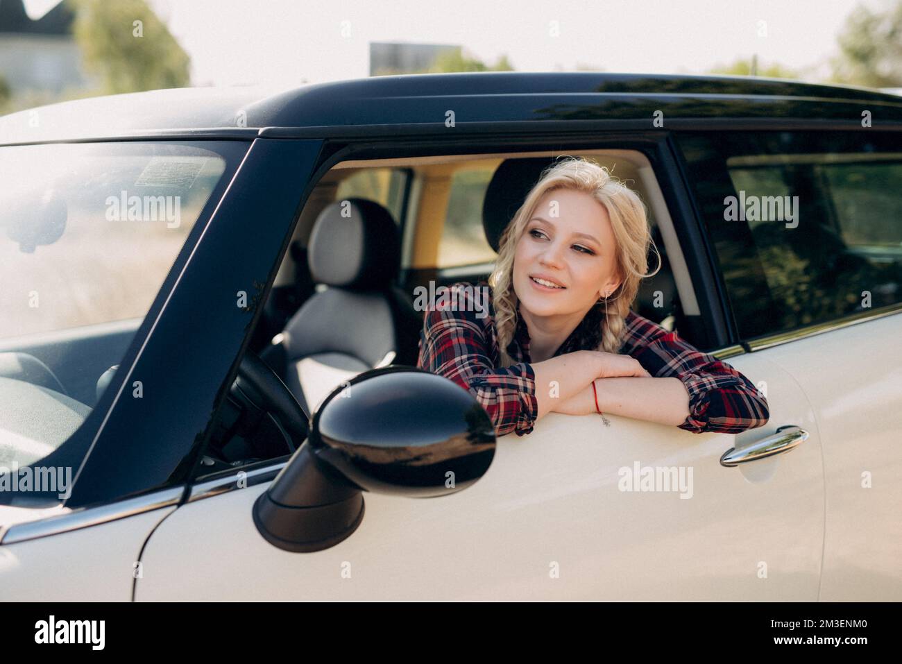blonde with pigtails in a shirt, jeans, red shoes and black glasses
