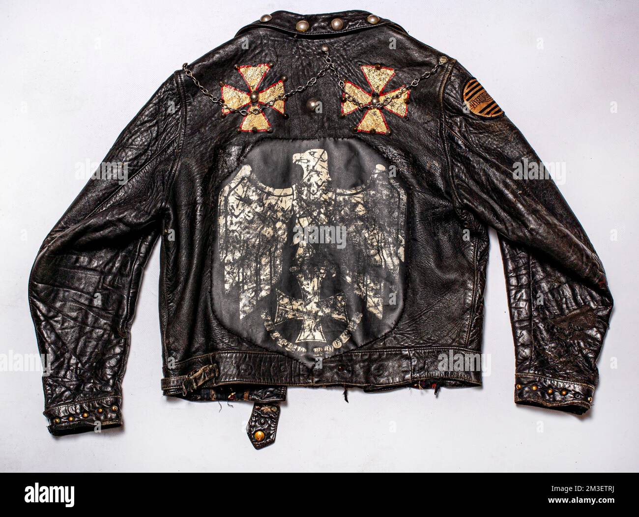 Vintage black leather biker jacket, isolated on white background Stock Photo