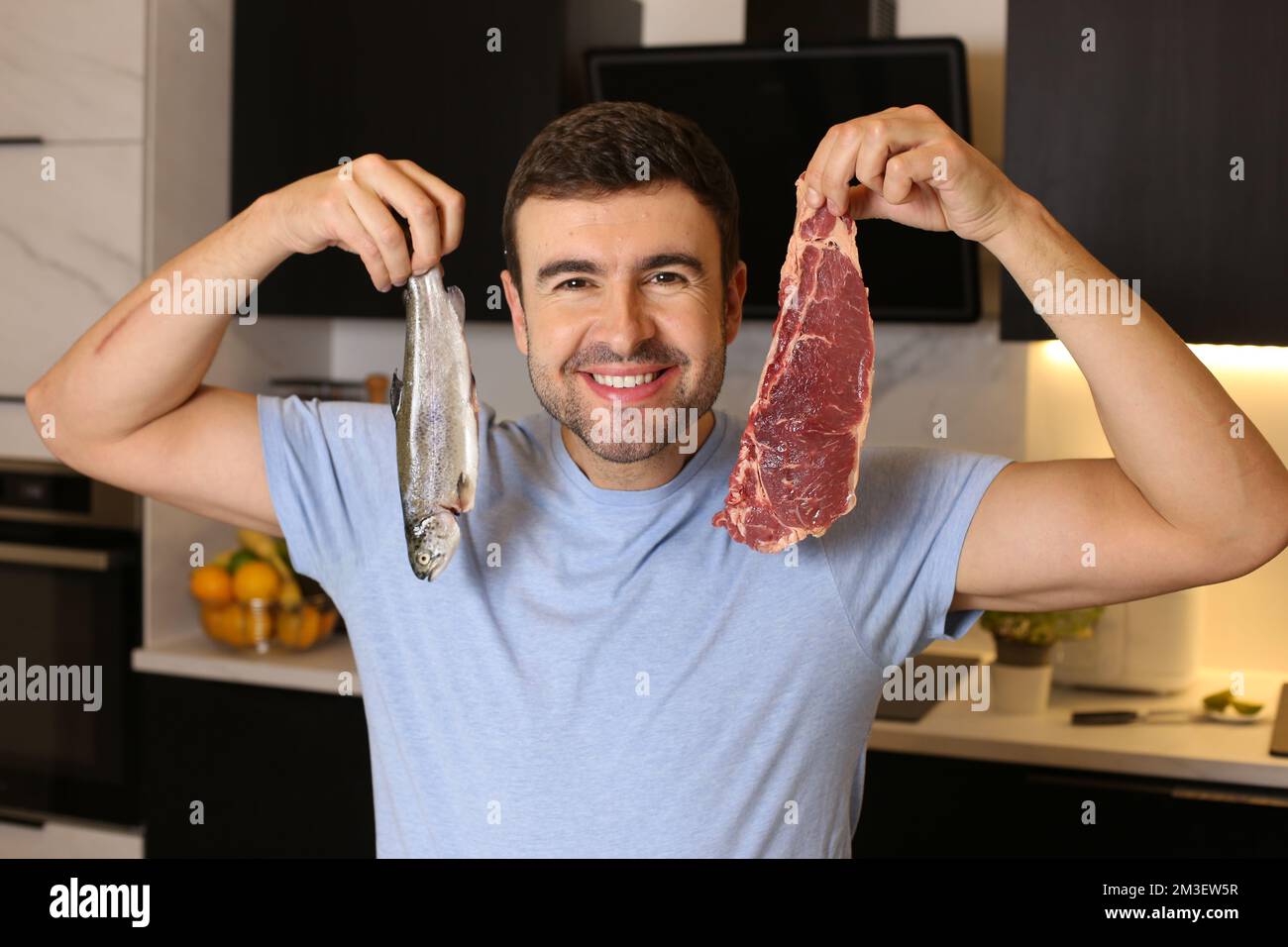 Man choosing between healthy food hi-res stock photography and images