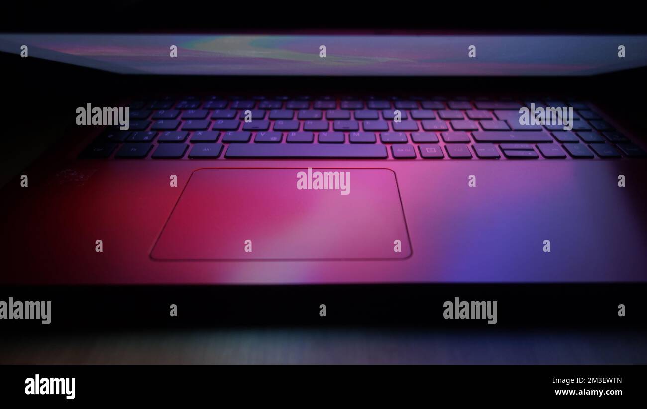 laptop computer keyboard illuminated with lights effects Stock Photo