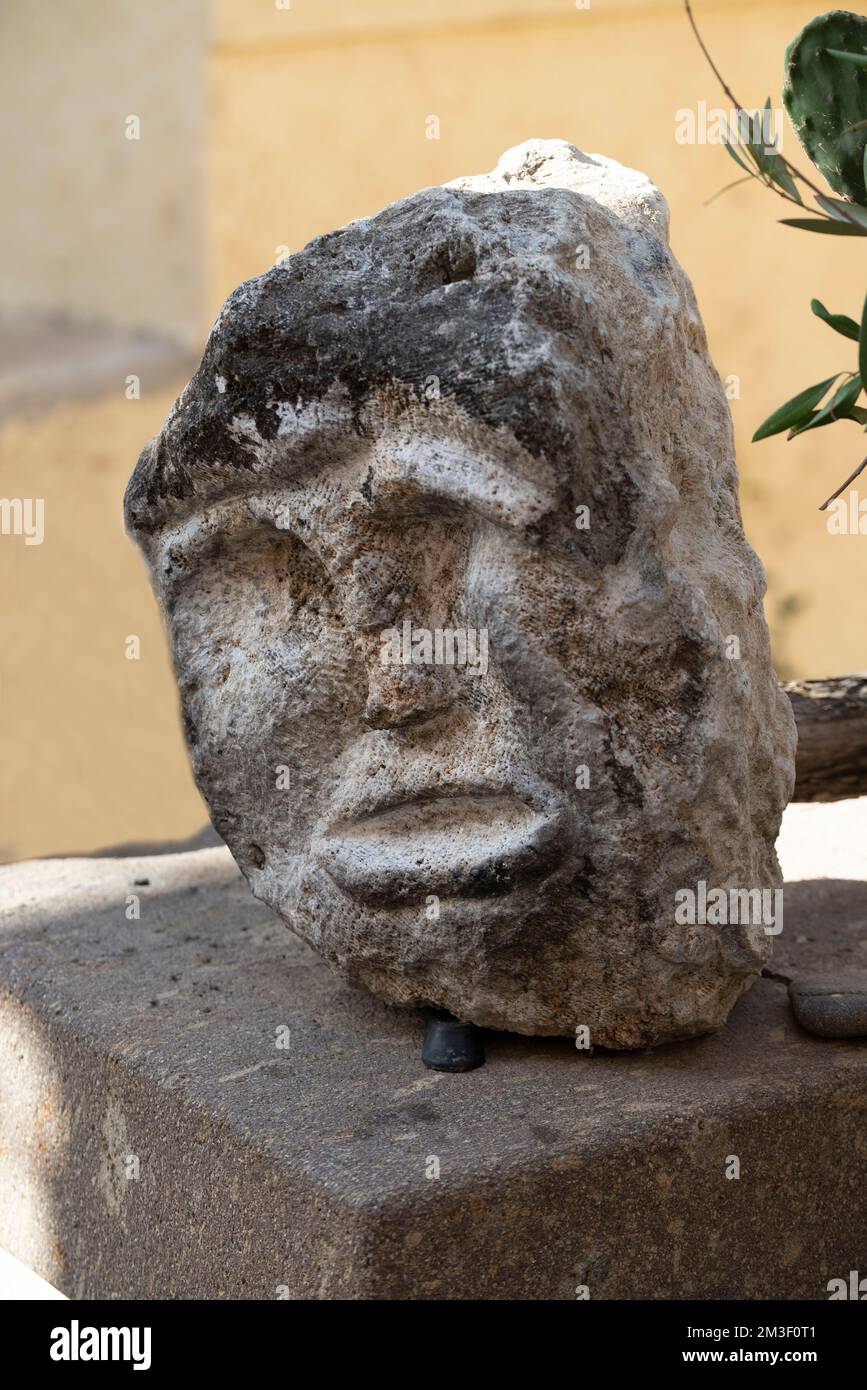 Castelsardo, Sardinia, Italy, 16102021Stone carve face as artwork
