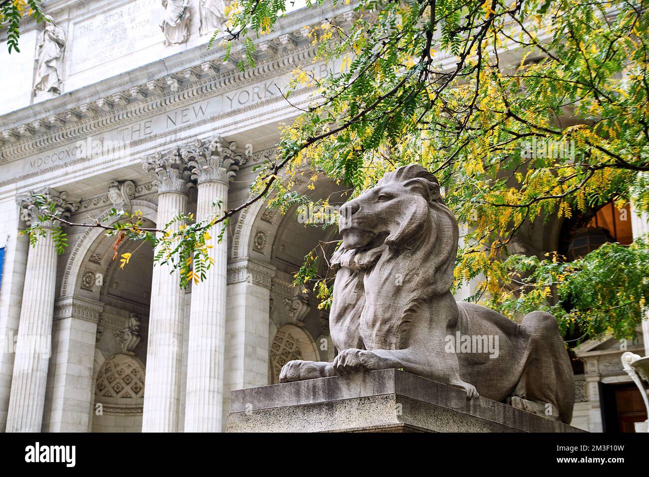 Lion sculpture at the steps of New York Public Library in autumn Stock Photo