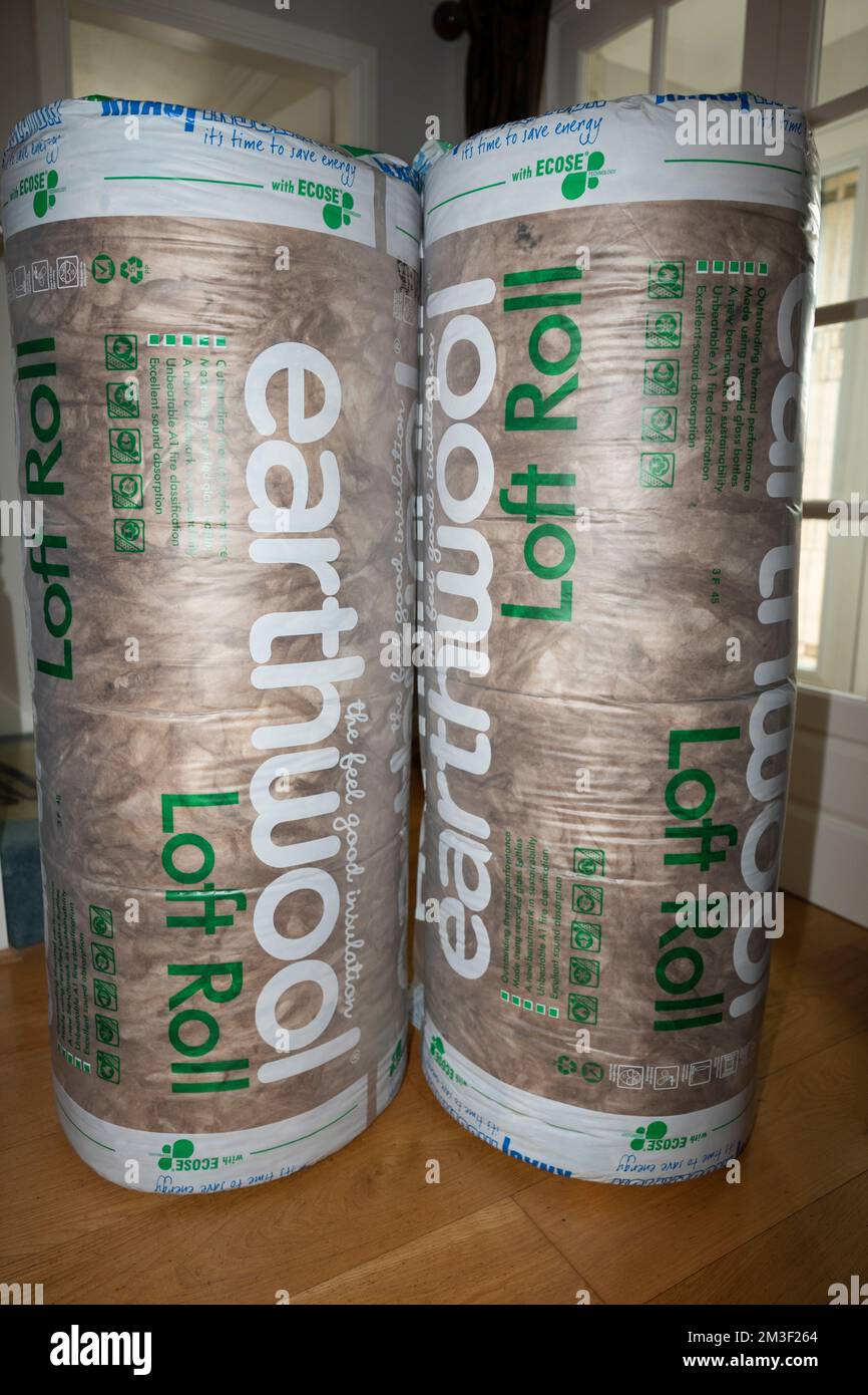 Fitting insulation in loft of 1990's house. Stock Photo