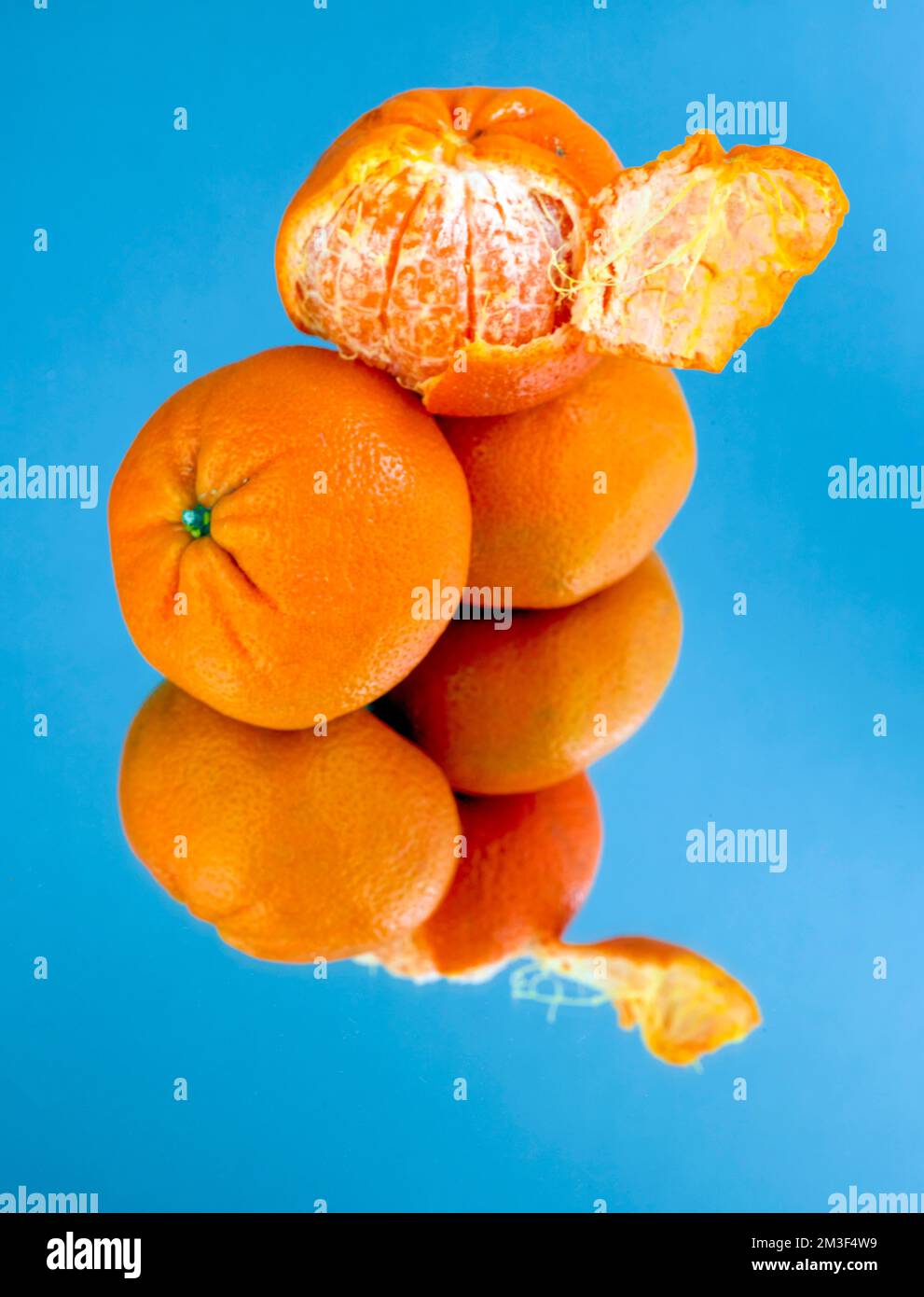 Easy peel sweet Tangerines on clean neutral background. Natural close