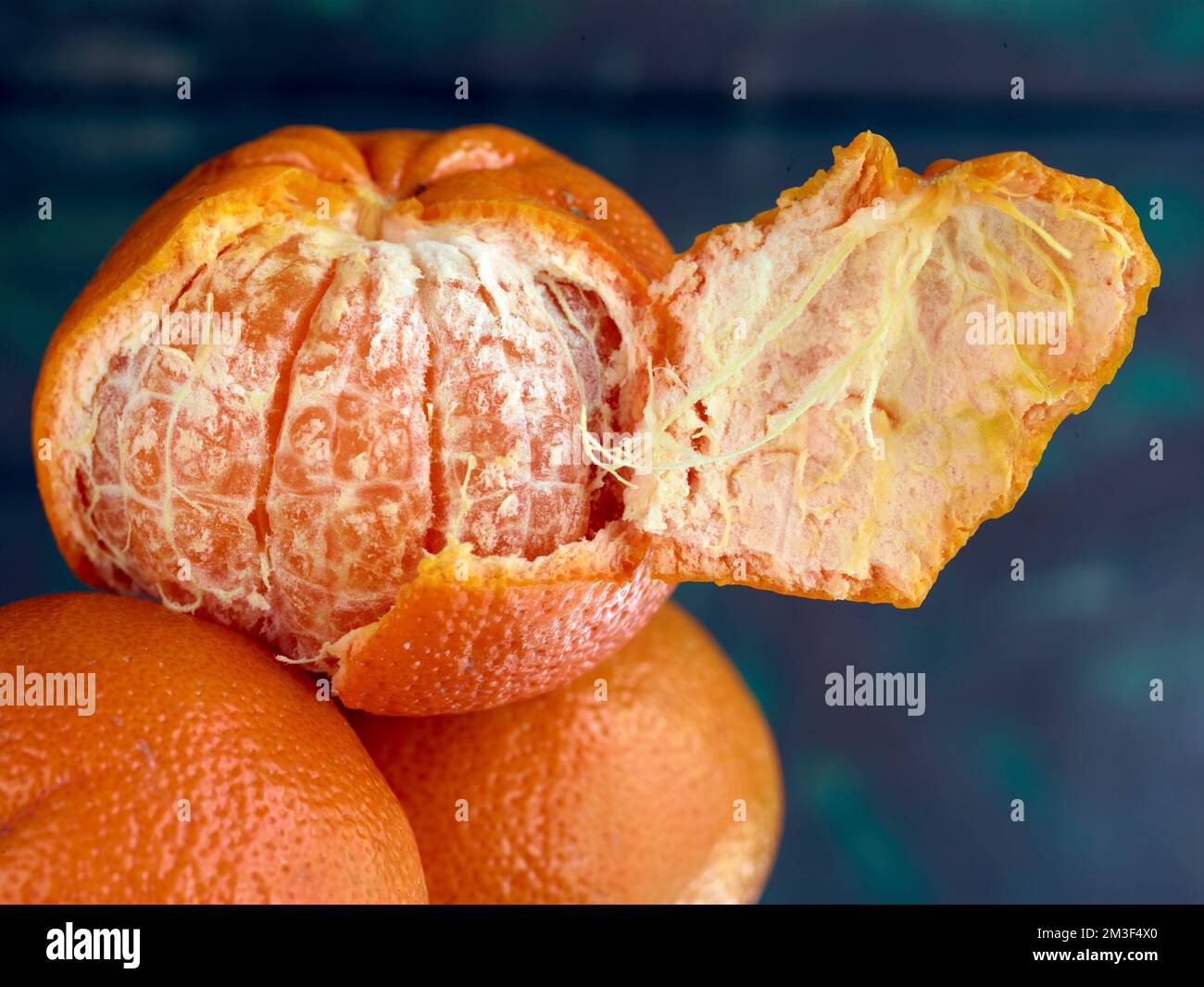 Easy peel sweet Tangerines on clean neutral background. Natural close
