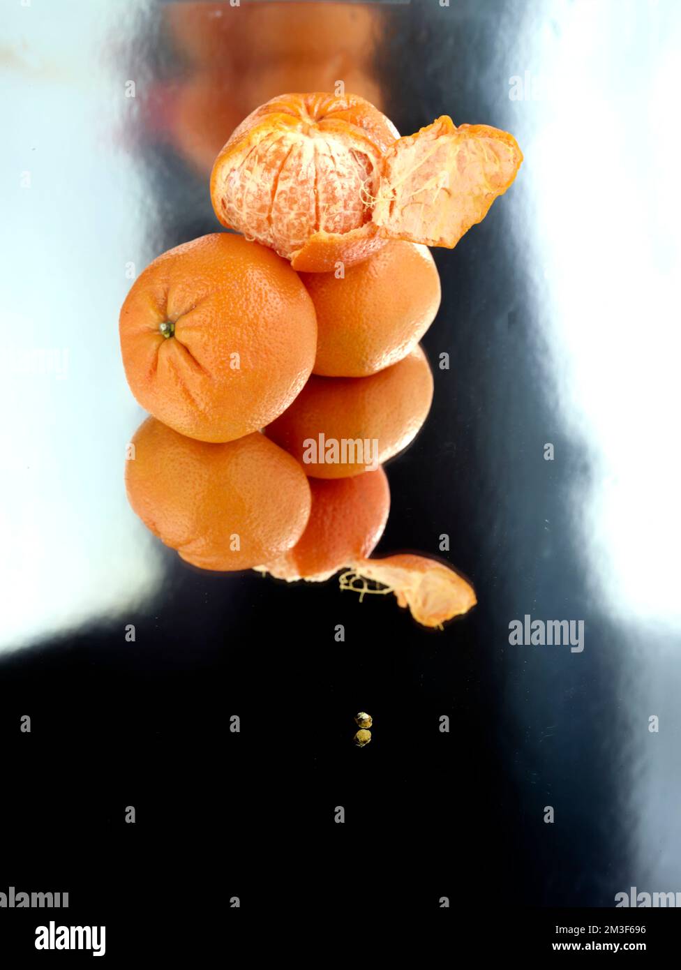 Easy peel sweet Tangerines on clean neutral background. Natural close