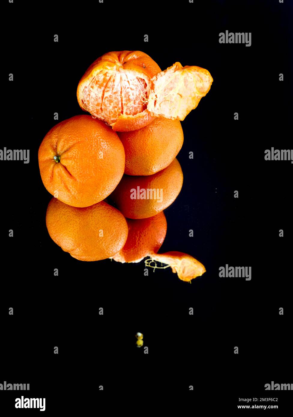 Easy peel sweet Tangerines on clean neutral background. Natural close