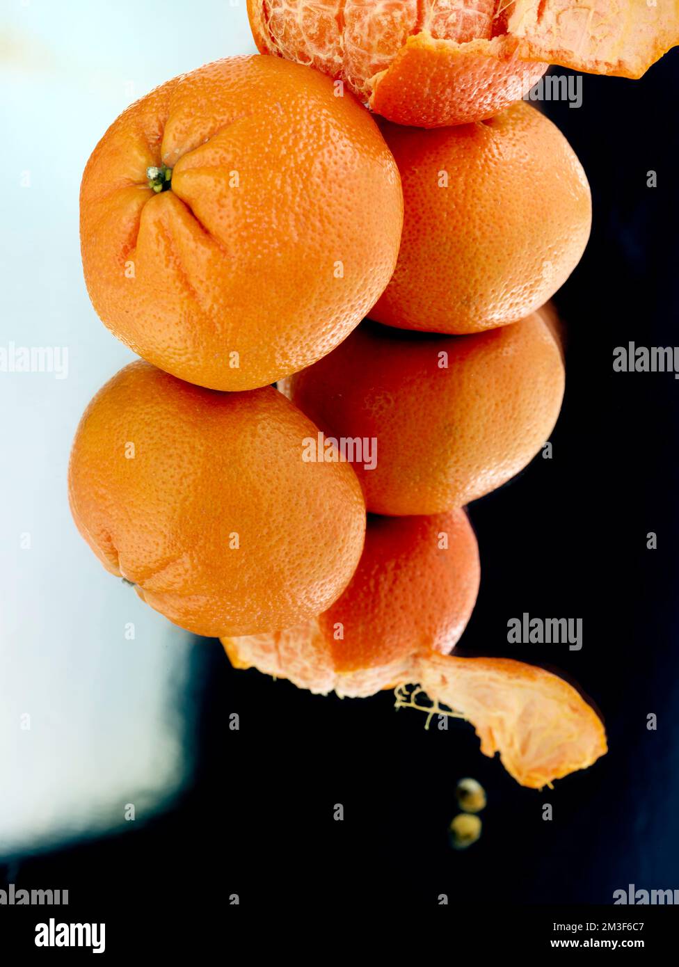Easy peel sweet Tangerines on clean neutral background. Natural close