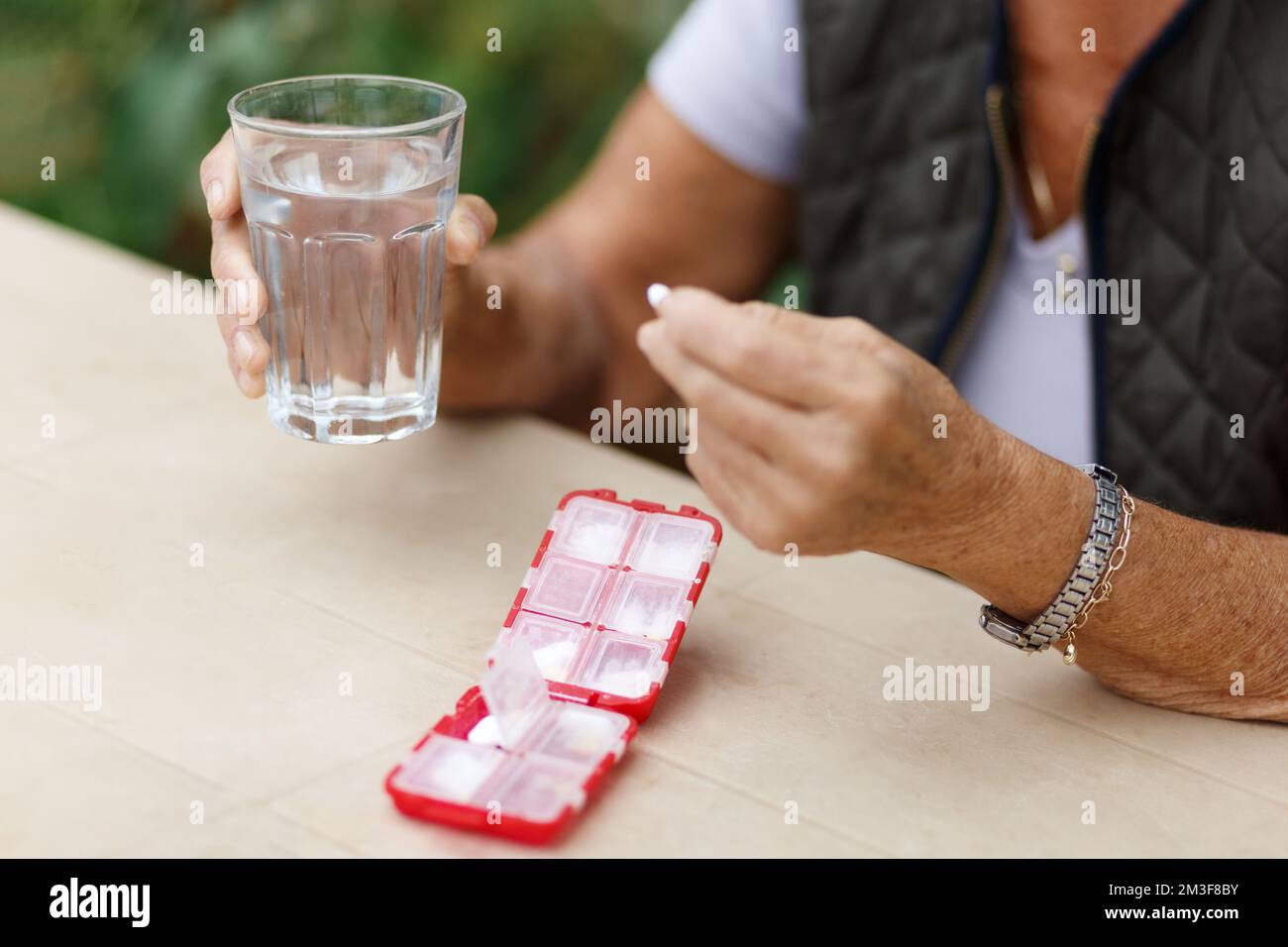 Senior woman take pills from box. Healthcare and old age concept with