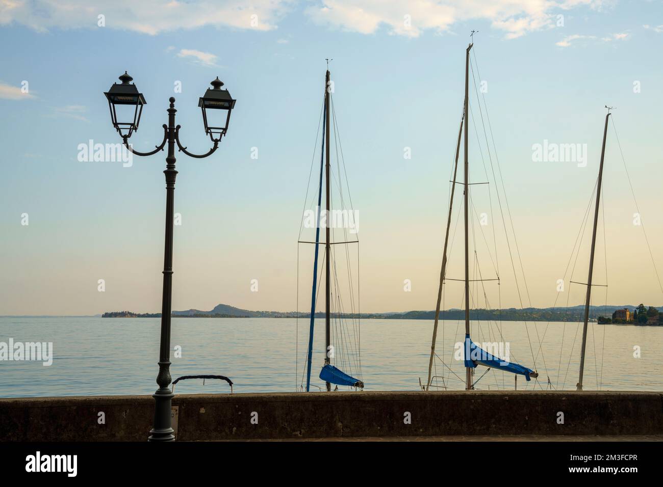 Garda lake at Toscolano Maderno, Brescia province, Lombardy, Italy, in a summer evening Stock Photo