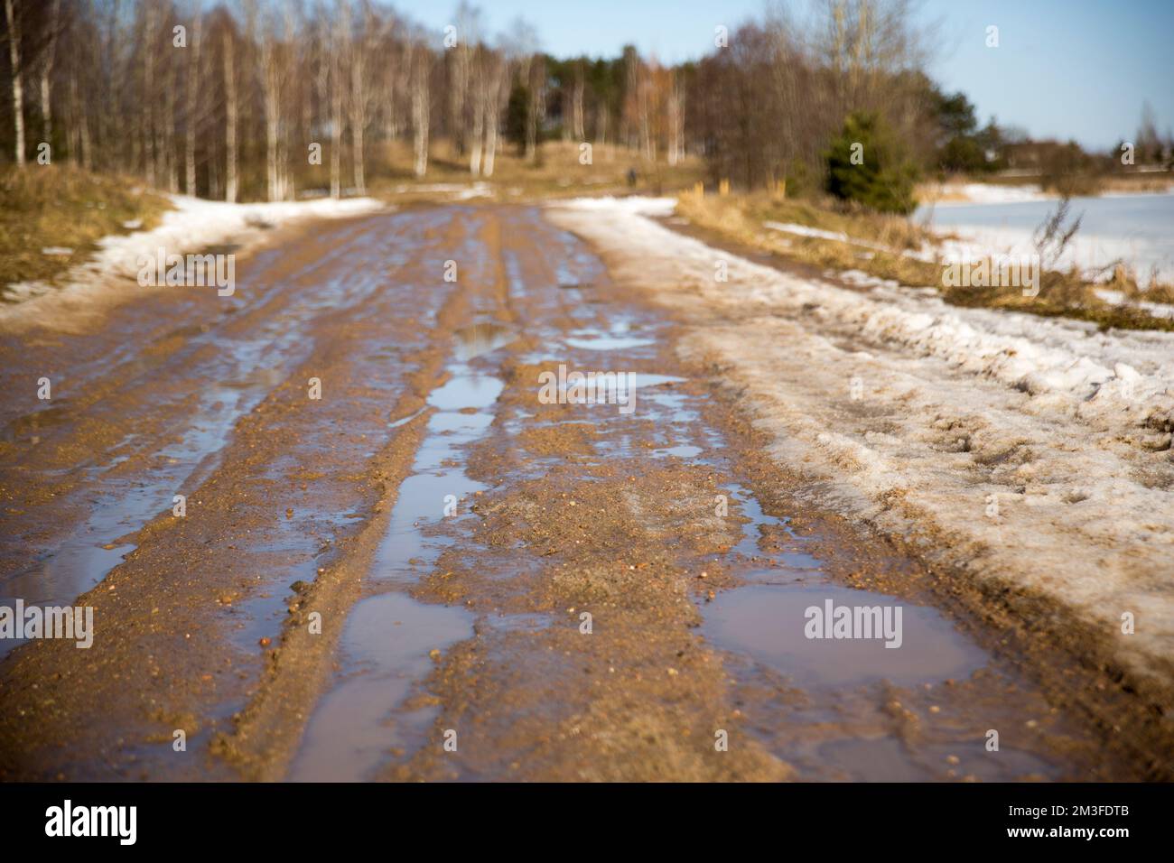 Rural dirty damaged road with muds and holes Stock Photo - Alamy
