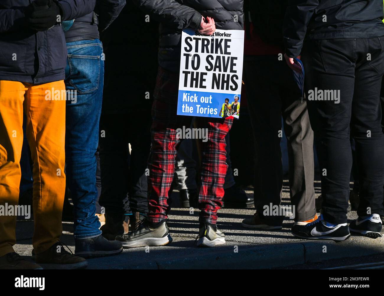 Brighton UK 15th December 2022 - Members of local unions and workers groups including the Socialist Worker gather outside Brighton's Royal Sussex County Hospital to show their support for the Nurses Strikes which began today . : Credit Simon Dack / Alamy Live News Stock Photo