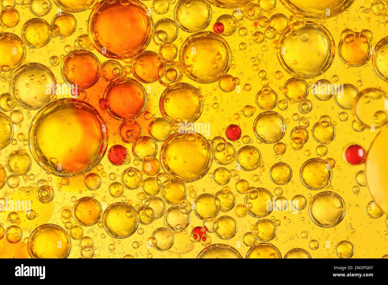 oil and water blisters on colored background Stock Photo Alamy