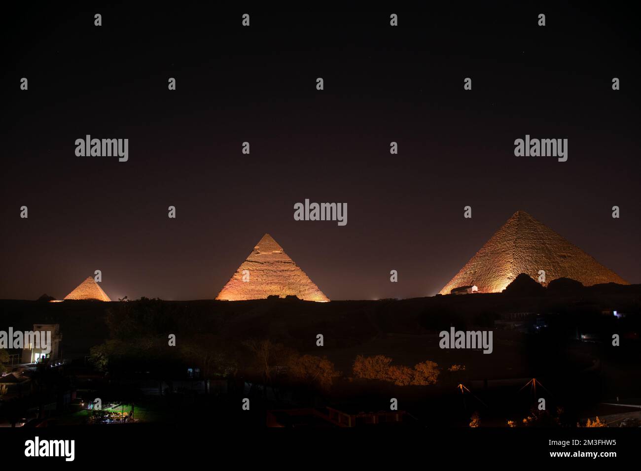 A view of the illuminated Pyramids of Giza in Egypt Stock Photo - Alamy