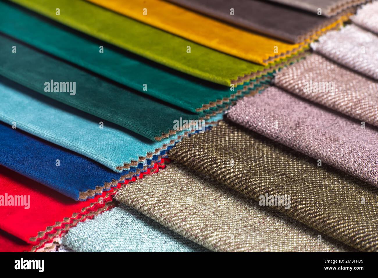 Bright collection of colorful textile samples. Fabric swatches, set in ...