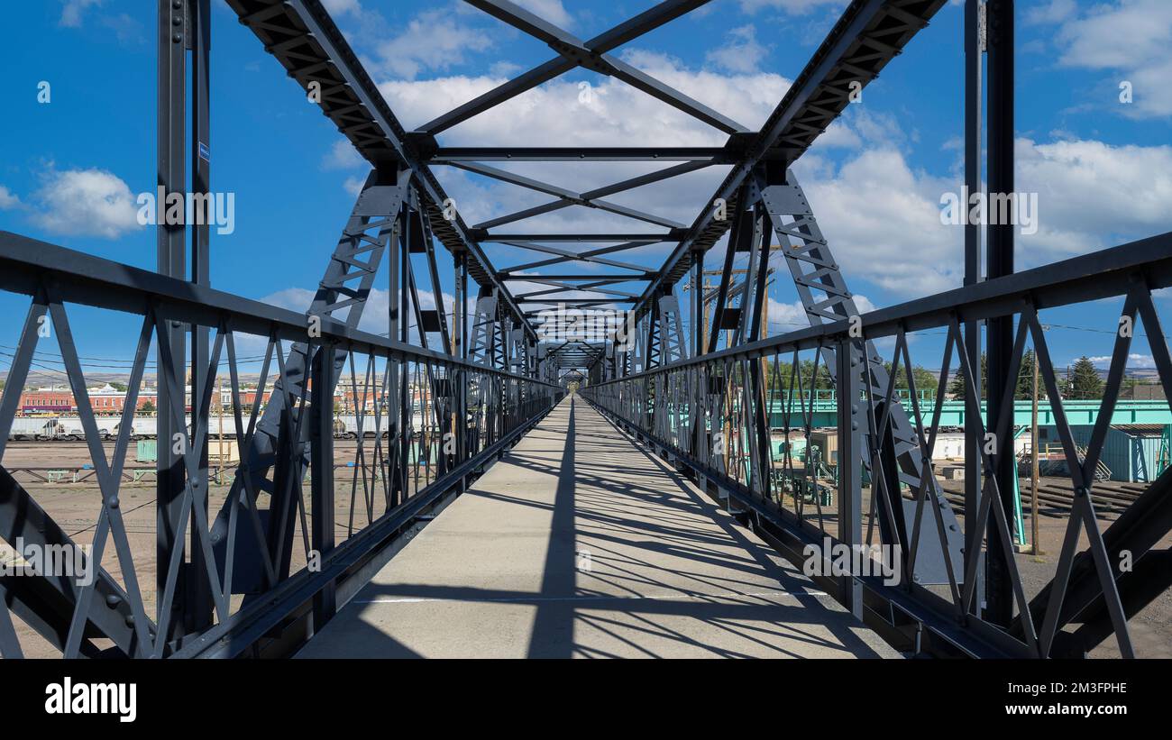 Downtown pedestrian footbridge over railroad tracks in Laramie, Wyoming Stock Photo