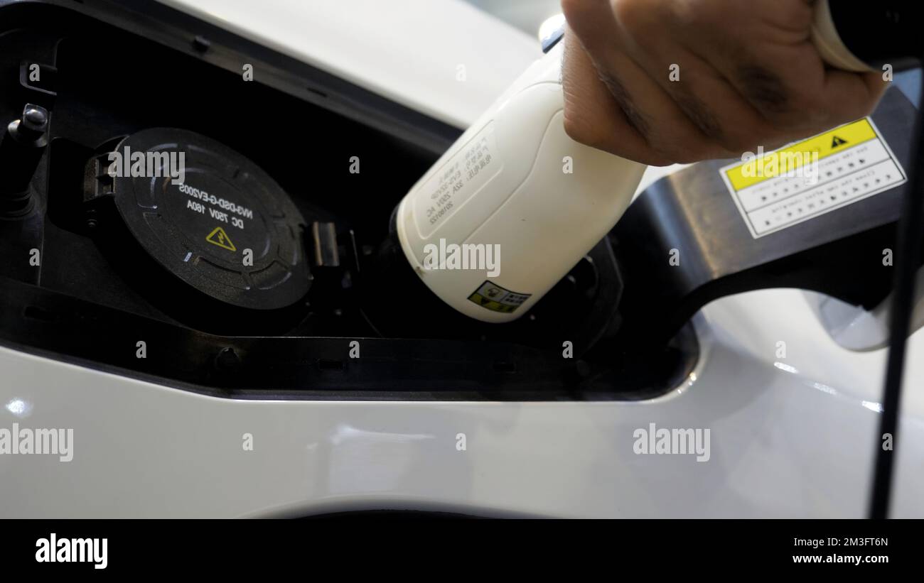 An outdoor electric vehicle charging facility. Media. Concept of