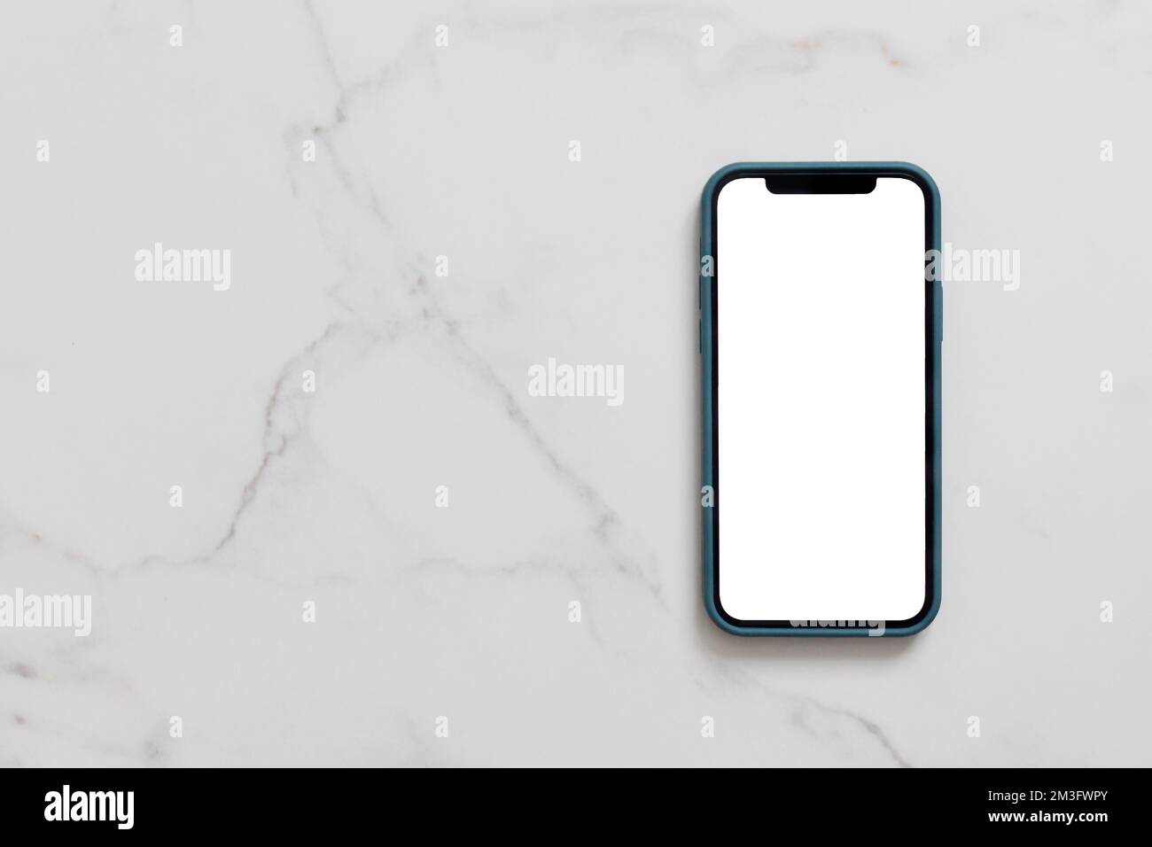 Smartphone with blank white screen in case on marble table, Mobile phone mock up Stock Photo