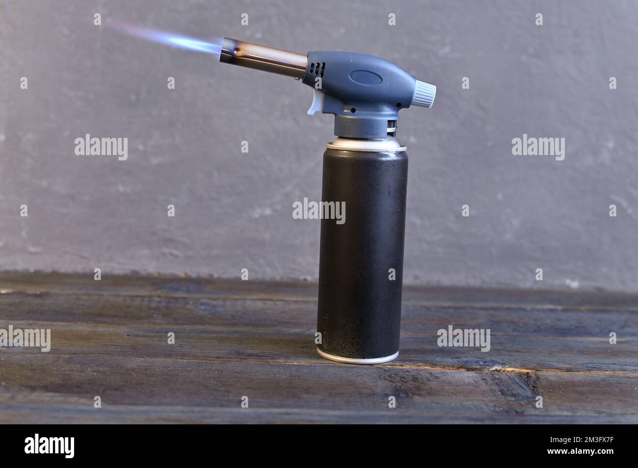 the gas soldering iron is on fire. High quality photo Stock Photo