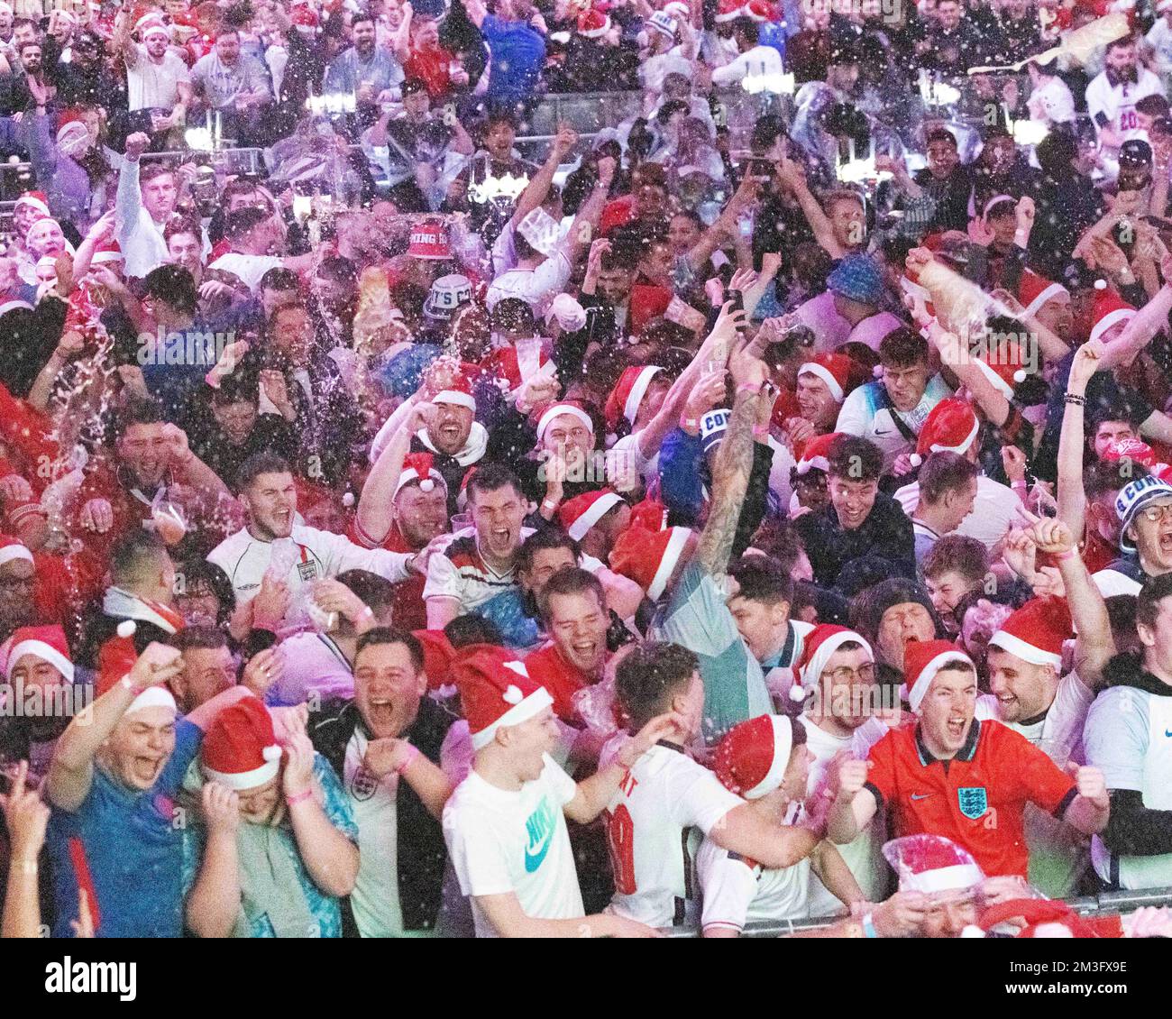 England fans throw beer in the air at Boxpark, Wembley, London, as