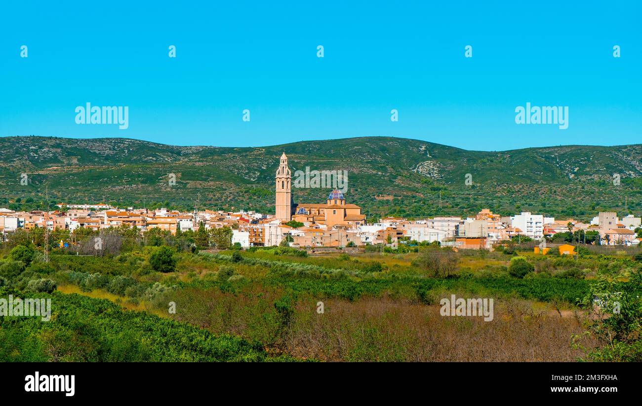 a panoramic view of Alcala de Xivert, in the province of Castellon, int the Valencian Community, Spain, highlighting the tall belfry of San Juan Bauti Stock Photo