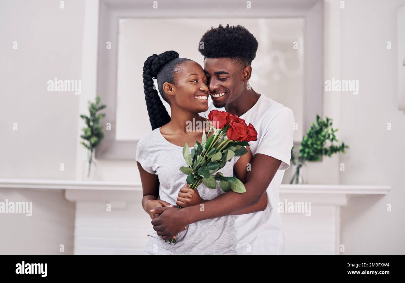 Romantic guy holding red roses hi-res stock photography and images - Alamy